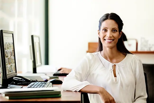 a woman smiling directly facing the camera